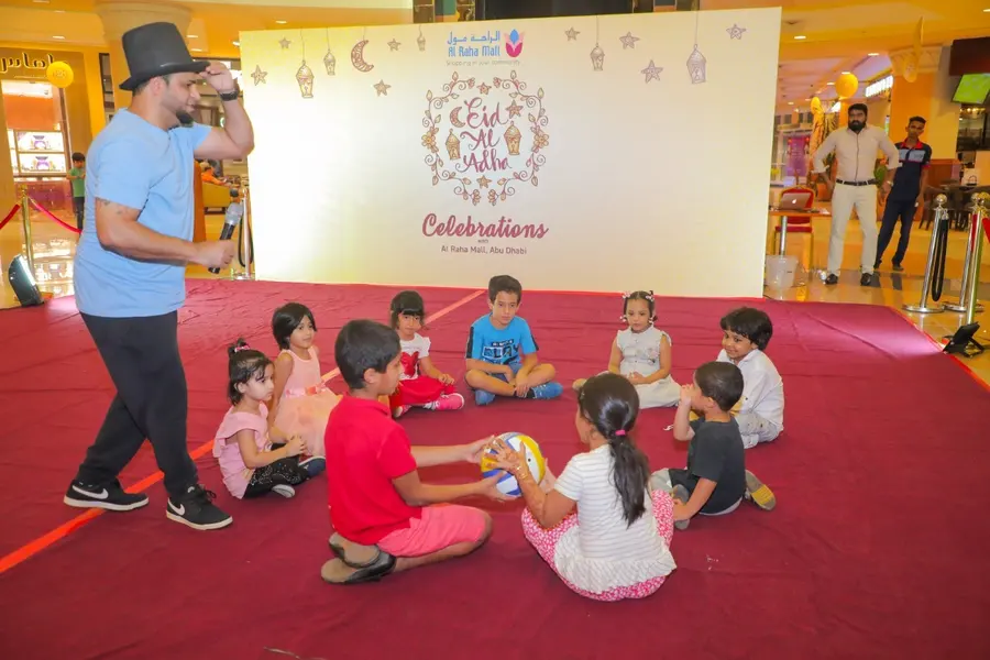 Entertainer leading children at an Eid celebration
