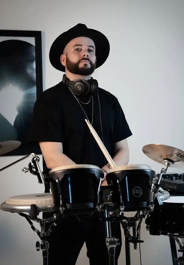 DJ playing with live percussion at a party
