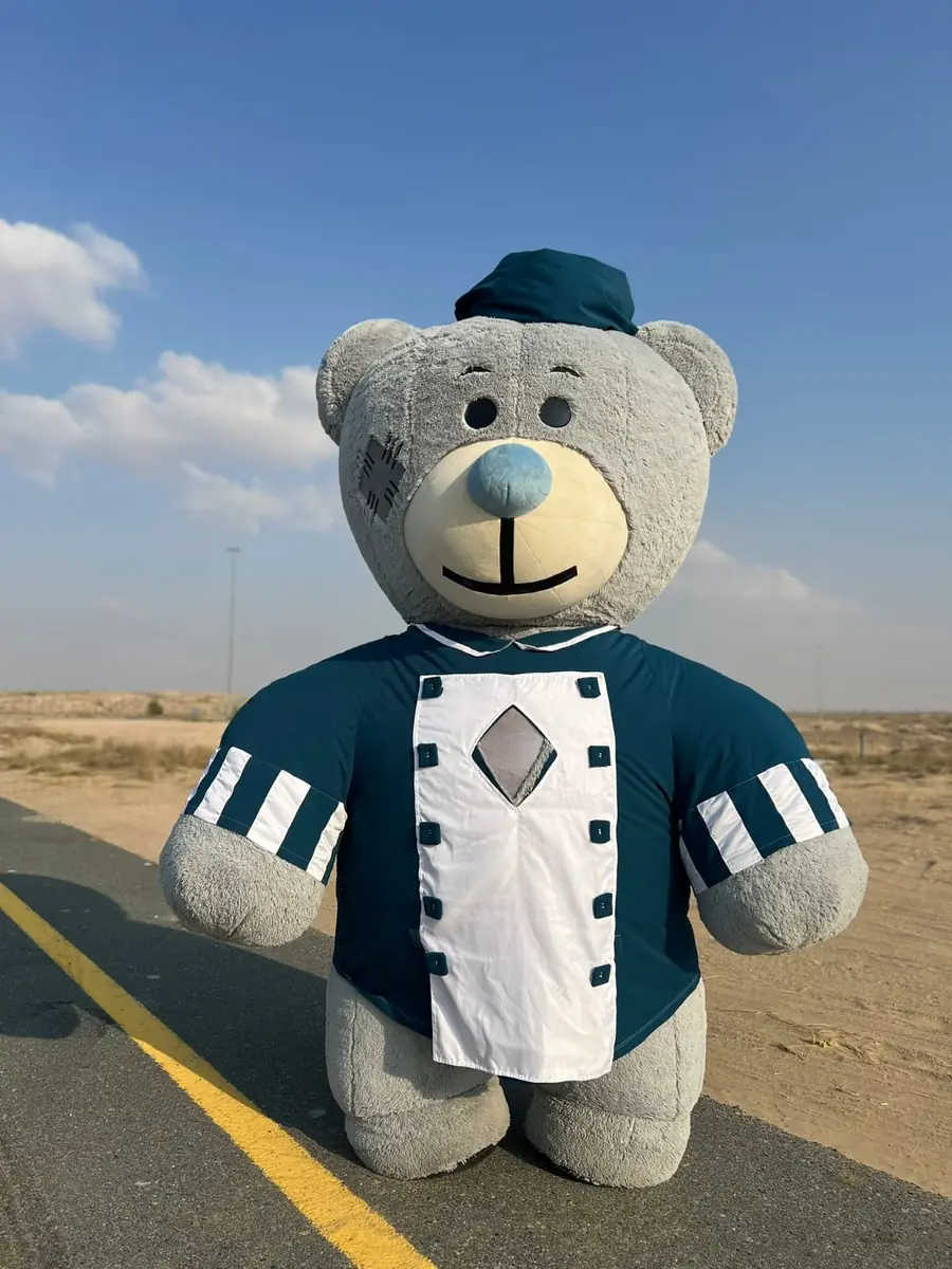 Giant teddy bear mascot ready to meet guests