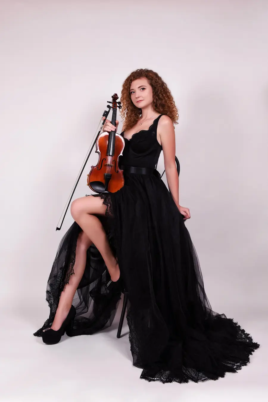 Violinist in a black gown ready to perform